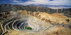 Aerial view of Kennecott's Bingham Canyon Mine - an open-pit copper mine - largest man-made excavation on earth
This open-pit copper mine has been in production since 1906 and is owned by Kennecott Utah Copper as of 2008. It is located in the Oquirrh Mountains near Salt Lake City, Utah. The pit over 0.75 mile, or 1.2 km deep, 2.5 miles  or 4 km wide, and covering 1,900 acres  or 7.7 square km.