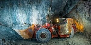 Working inside gold mine tunnel. Gold mining.