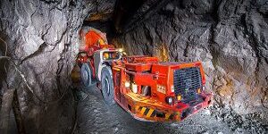 Loading truck with golden ore underground. russia.